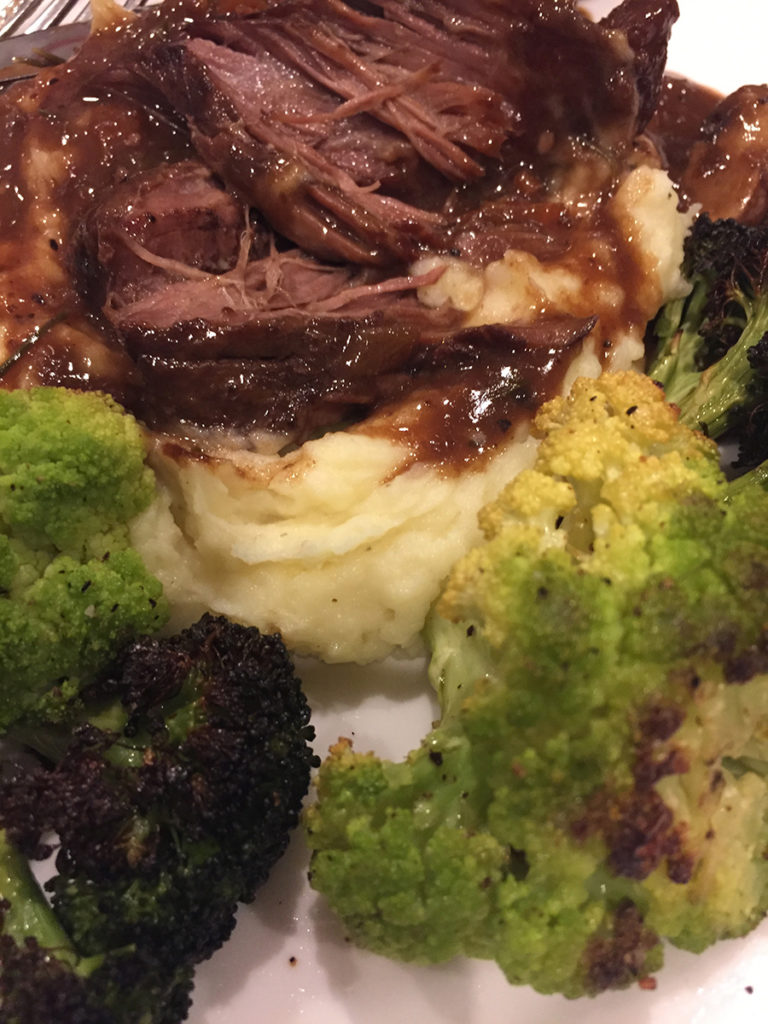 braised short ribs in a mushroom wine gravy, mashed potatoes and roasted broccoli