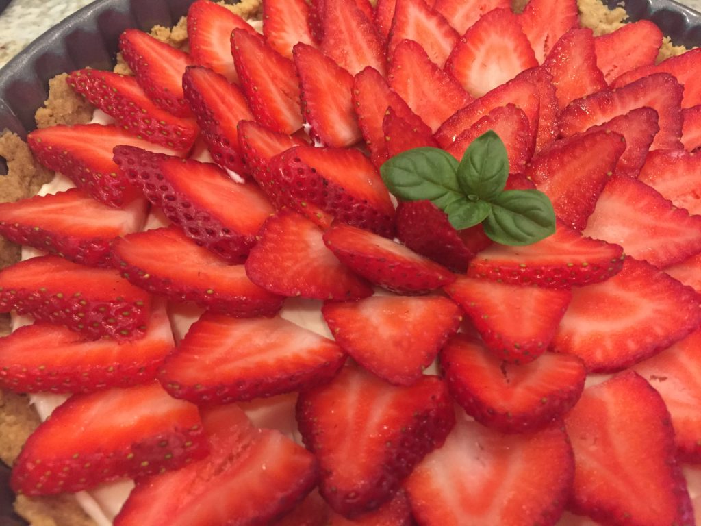 strawberry tart with basil garnish
