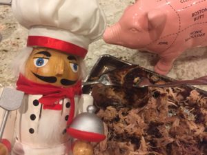 Pulling smoked pork shoulder