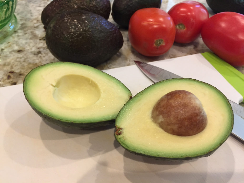 Sliced avocado with pit