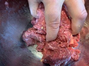 Mixing homemade burgers for the grill