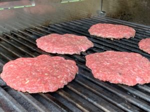 Hamburger patties on the grill