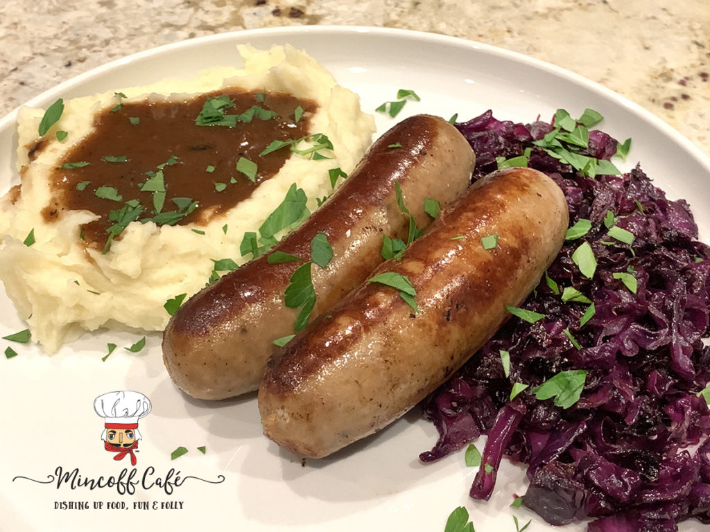 Bangers & Mash with Fried Reg Cabbage, sprinkled with parsley