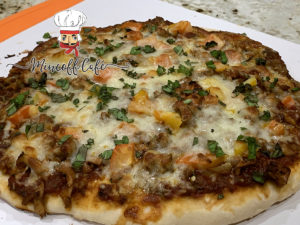 Sausage and chanterelle cheesy pizza.