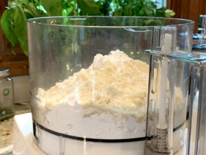 Almond flour and powdered sugar in a food processor.