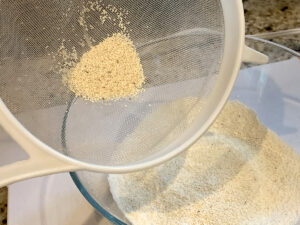 A small amount of almond flour and powdered sugar that was too big to fit through the sieve.