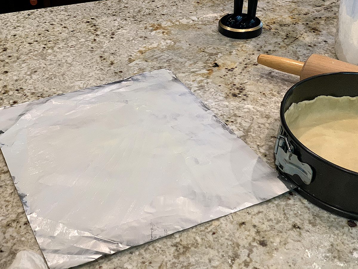 Square piece of foil with a very thin coating of butter on it. 