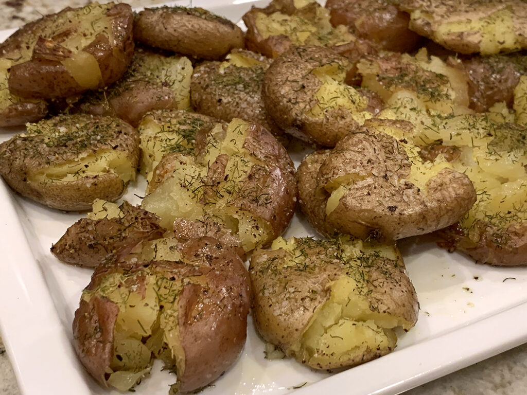Slightly smashed and roasted baby potatoes seasoned with dill weed. 